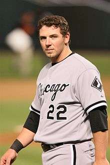 Josh Fields, standing, looking at the camera, wearing number 22 for the Chicago White Sox.