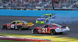 In this unlucky moment of the race, driver Robby Gordon spins out in front of Kyle Petty and Ken Schrader.