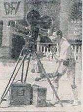 A grainy picture of a man with a video camera