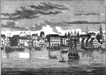 Drawing or etching of quiet river port with many boats and many three-story buildings along water's edge