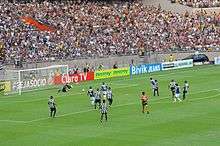 A shot of a penalty kick being taken in a football match