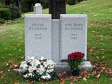 A twin gravestone bearing the name "Frank O'Connor" on the left, and "Ayn Rand O'Connor" on the right