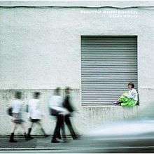 A woman sitting on a ledge at the bottom of a concrete garage building while motion-blurred school children walk past