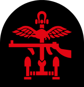 Insignia of Combined Operations units it is a combination of a red Thompson submachine gun, a pair of wings and an anchor on a black backing