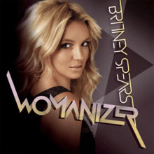 Upper bust of Britney Spears. She looks into the camera over her right shoulder. Her mouth is slightly open. She is wearing a black top with small holes. The background is composed by geometric figures in different shades of purple. In an upside down vertical direction, the words "BRITNEY SPEARS" are written in light yellow capital letters. On the lower part of the image, the word "WOMANIZER" is written in capitals with shades of light violet and light yellow.
