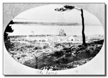 black and white postcard of the site, with the sea in the background