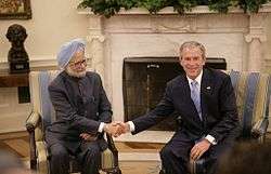 President George W. Bush (right) shakes hands with India's Prime Minister Dr. Manmohan Singh, Monday, July 18, 2005, during their meeting in the Oval Office.