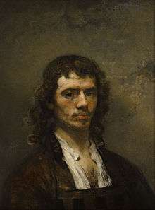 Portrait of a man with long hair wearing brown clothes over a light shirt