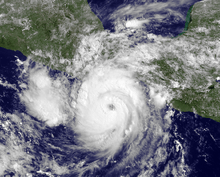 Satellite image of Carlotta developed an eye and a central dense overcast, with thunderstorms and clouds.