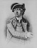 Signed black and white print of a man in military uniform and tricorne hat genturing with his right hand
