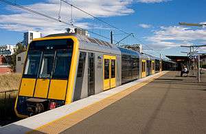 A T set Tangara in current Sydney Trains livery with yellow front.