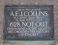 A plaque that reads: "Upon this ground // A. E. J. COLLINS // in a junior House Match // in June 1899 scored // 628 NOT OUT // THIS INNINGS IS THE HIGHEST // RECORDED IN THE HISTORY // OF CRICKET"