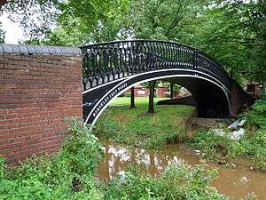 A small iron bridge over a stream