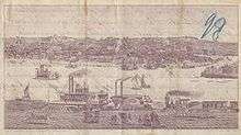 An old image shows the Mississippi River in the middle with several boats traversing it. On both sides of the river are several buildings.