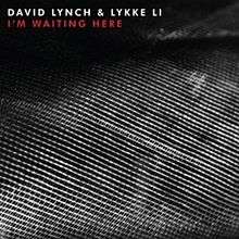 A black-and-white image of a sewn texture. White and red text above reads "David Lynch and Lykke Li I'm Waiting Here".