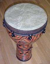 Fibreglass djembe with synthetic skin and lug tuning system
