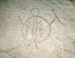 This petroglyph was created prior to the arrival of the horse. It shows a warrior carrying a body shield