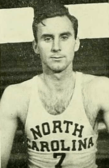 A basketball player wearing a jersey that reads "North Carolina".