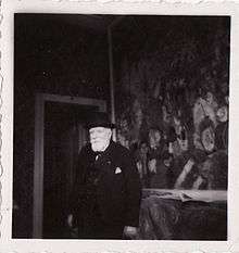 James Sidney Edouard, Baron Ensor in front of "Entry of Christ into Brussels" in his house in Ostend, 1940's, photo by Albert Lilar
