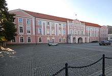 Toompea Castle pink stucco three story building with red hip roof
