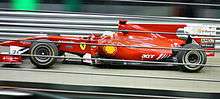 Felipe Massa driving a red Ferrari Formula One car in Singapore