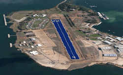An island with building on the left and right. Center is a conceptual design of the runway covered in solar panels.