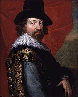Painting of a bearded, moustached man wearing a hat and ornate 17th century garb, including a fluted, lace collar. He looks directly at the viewer.