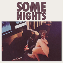 The album's title is written in brown letters while below it is a rectangular picture of two people in a motel with the man sitting down with a lighter and the woman with her legs crossed holding a cigarette.