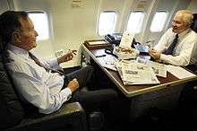 Robert Gates and George H. W. Bush on a C-32