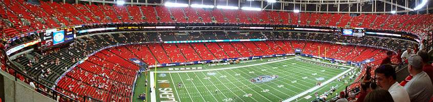 Fans enter the red and black seats in the Georgia Dome prior to the game.