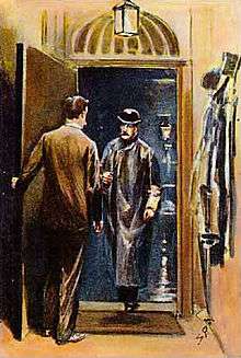 Man answering the door to a bowler-hatted man in a raincoat