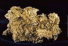 An irregularly shaped nugget of native gold.
