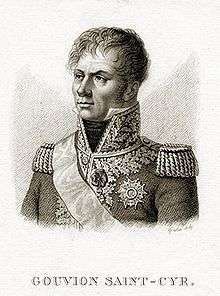 Print depicts a hatless and clean-shaven man with a confident look. Looking to the viewer's left, he wears a dark military coat with epaulettes and a high collar with lots of gold braid.