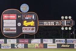 A black guitar-shaped scoreboard towers over the left-center field wall.