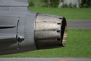 Side-view of circular aircraft engine exhaust nozzle, showing two distinct layers