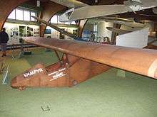 A small glider on display at a museum