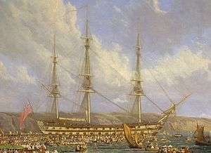 Oil painting of a three-masted sailing ship seen from side against a background of cliffs, with many small boats filled with people in the foreground