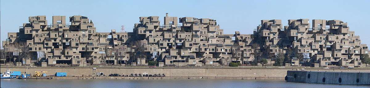 A wide image showing a complete view of Habitat 67 as seen from the port.