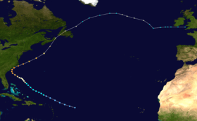 Path of a tropical cyclone on a map, with colored dots representing the storm's position and intensity in six-hour intervals. The track begins and bottom-center, moves towards left-center, and then moves back right to the upper-right corner.
