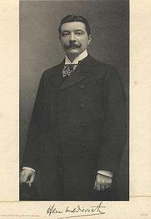 antique photo of a formally dressed dark haired man