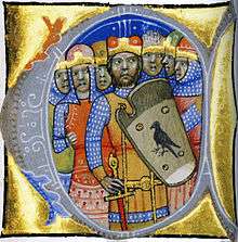 Seven warriors, one of them wearing a coat-of-arms which depicts a predatory word