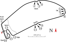 A track map of the Hockenheimring circuit. The track has 16 corners, which range in sharpness from hairpins to chicanes. There are four long straights that link the corners together. The pit lane splits off from the track on the inside of Turn 15, and rejoins the track after the exit of Turn One.