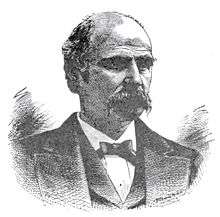  An engraving of a man with a mustache in a suit and tie