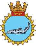 Submarine crest with a large, spotted fish