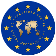 https://ipfs.io/ipfs/QmXoypizjW3WknFiJnKLwHCnL72vedxjQkDDP1mXWo6uco/I/m/Insignia_of_the_EU_Operations_Centre.svg.png