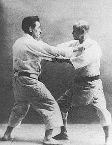 Kyuzo Mifune (left) and Kanō Jigorō (right)