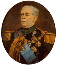 Half-length painted portrait depicting a gray-haired man with moustache wearing a military tunic with epaulettes, lanyards, blue sash, and several medals and orders on his breast and at his neck