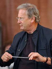 conductor John Eliot Gardiner at work in rehearsal, looking to the left. Photo credit Maciej Goździelewski.