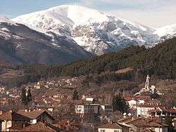 The town of Kalofer with a snowy mountain in background.
