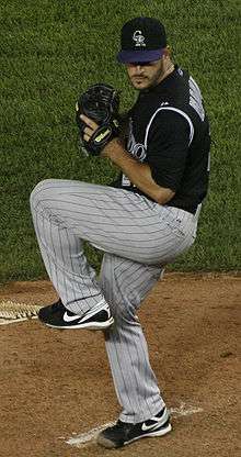 Jason Marquis throws a pitch wearing a Colorado Rockies uniform